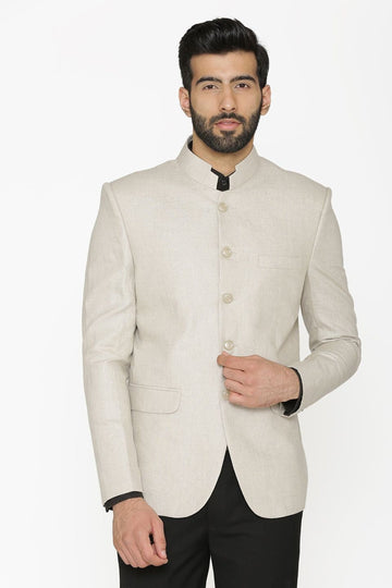 Madhu Couture Indian Designer Partywear Ethnic Off white Bandhgala Jodhpuri Suit With Black Pant For Men.